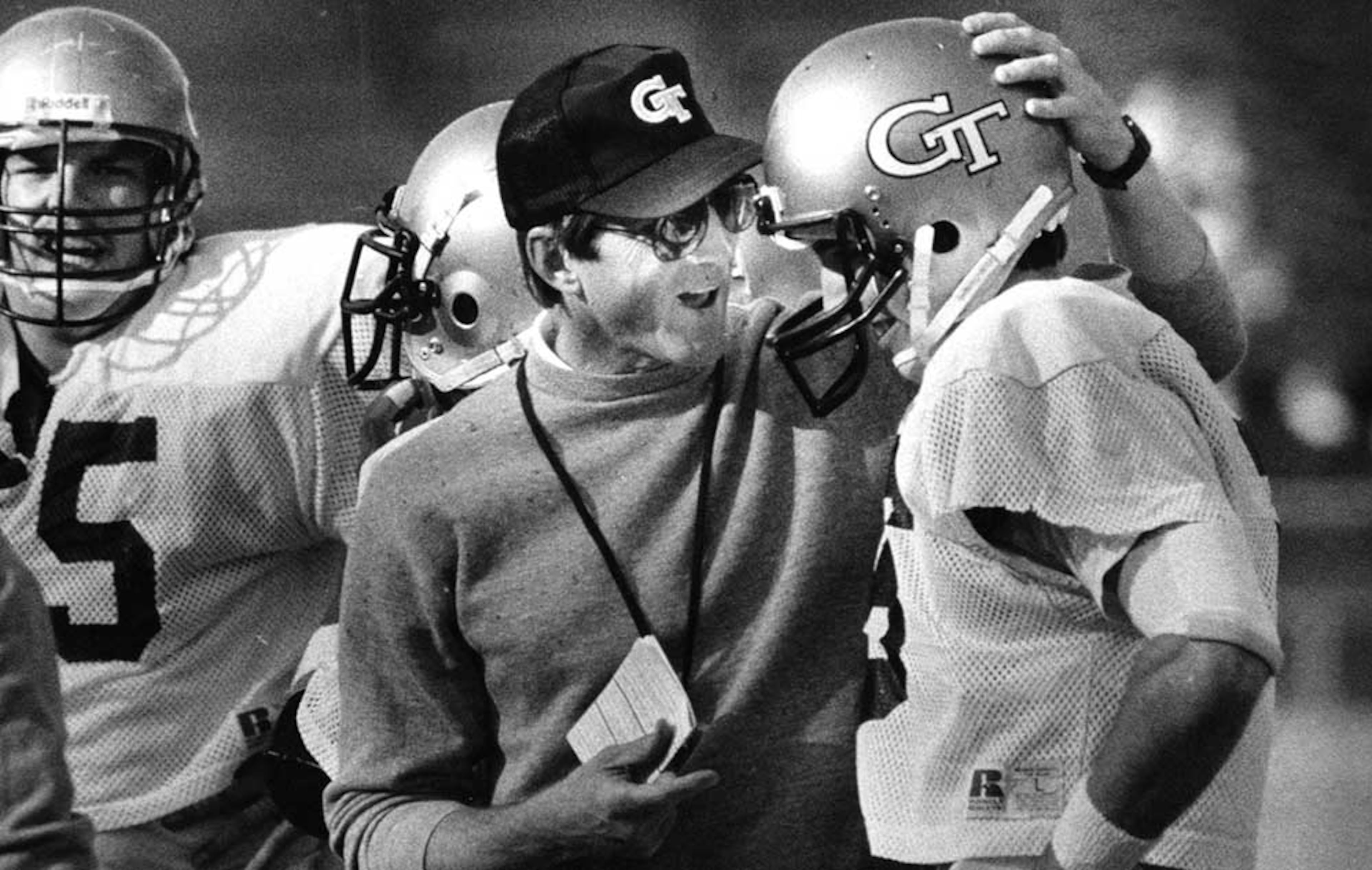 Georgia Tech head football coach Bill Curry affirms a job well done to QB Rick Strom during a 1986 scrimmage at Grant Field. (John Spink/AJC)