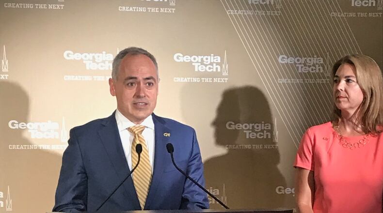 Incoming Georgia Tech President Ángel Cabrera answers questions from reporters on campus on June 14, 2019 as his wife, Beth, listens. Cabrera and his wife met while students at Georgia Tech. He's scheduled to take office in September. ERIC STIRGUS / ESTIRGUS@AJC.COM