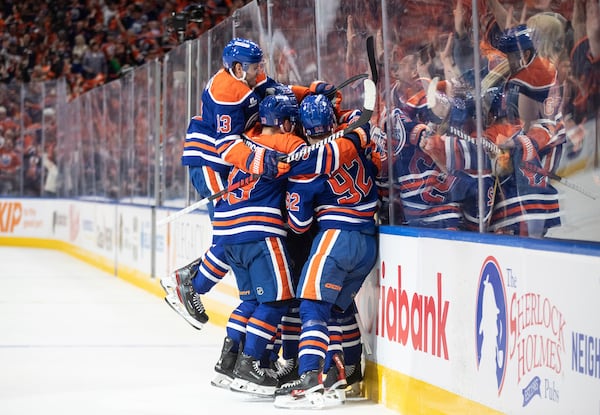 Edmonton Oilers players celebrate Darnell Nurse's goal against the Los Angeles Kings during the second period of an NHL hockey game in Edmonton, Alberta, Thursday, May 1, 2025. (Jason Franson/The Canadian Press via AP)