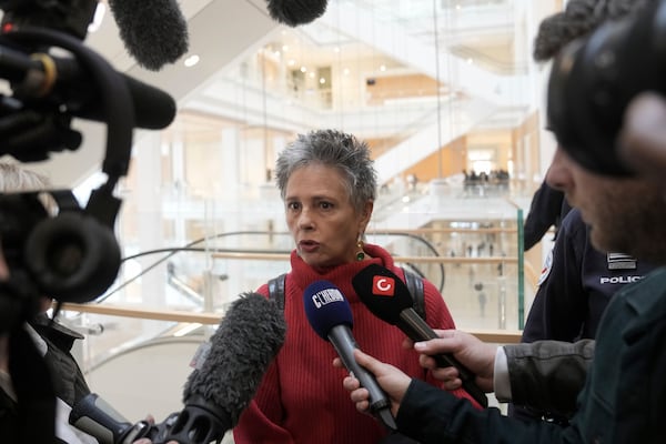 Actor Anouk Grinberg answers reporters outside the courtroom before actor Gerard Depardieu faces trial for the alleged sexual assaults of two women on a film set in 2021, Monday, March 24, 2025 in Paris. (AP Photo/Thibault Camus)