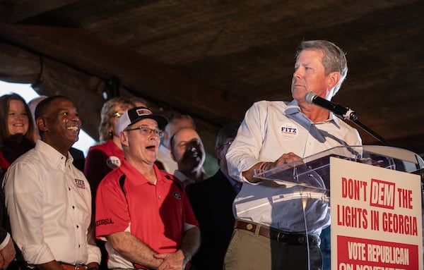 Commissioners Tim Echols and Fitz Johnson campaign with support from Gov. Brian Kemp at a rally in Cumming at Reid Barn on Oct 7, 2025.  (Jenni Girtman for the AJC)