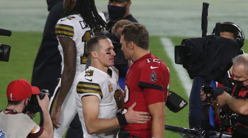 New Orleans Saints quarterback Drew Brees (9) talks with Tampa Bay Buccaneers quarterback Tom Brady (12) after the Buccaneers' loss to the Saints on Sunday, Nov. 8, 2020 at Raymond James Stadium in Tampa, Florida. (Doug Clifford/Tampa Bay Times/TNS)