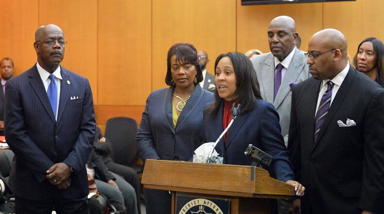 Prosecutors speak during a press conference following sentencing for 10 of the 11 defendants convicted of racketeering and other charges in the Atlanta Public Schools test-cheating trial. Kent D. Johnson/Atlanta Journal-Constitution.