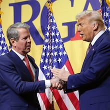President Donald Trump, right, shakes hands with Gov. Brian Kemp, R-Ga., as he delivers remarks at the Republican Governors Association Meeting at The National Building Museum on Feb. 20, 2025, in Washington, D.C. (Win McNamee/Getty Images/TNS)