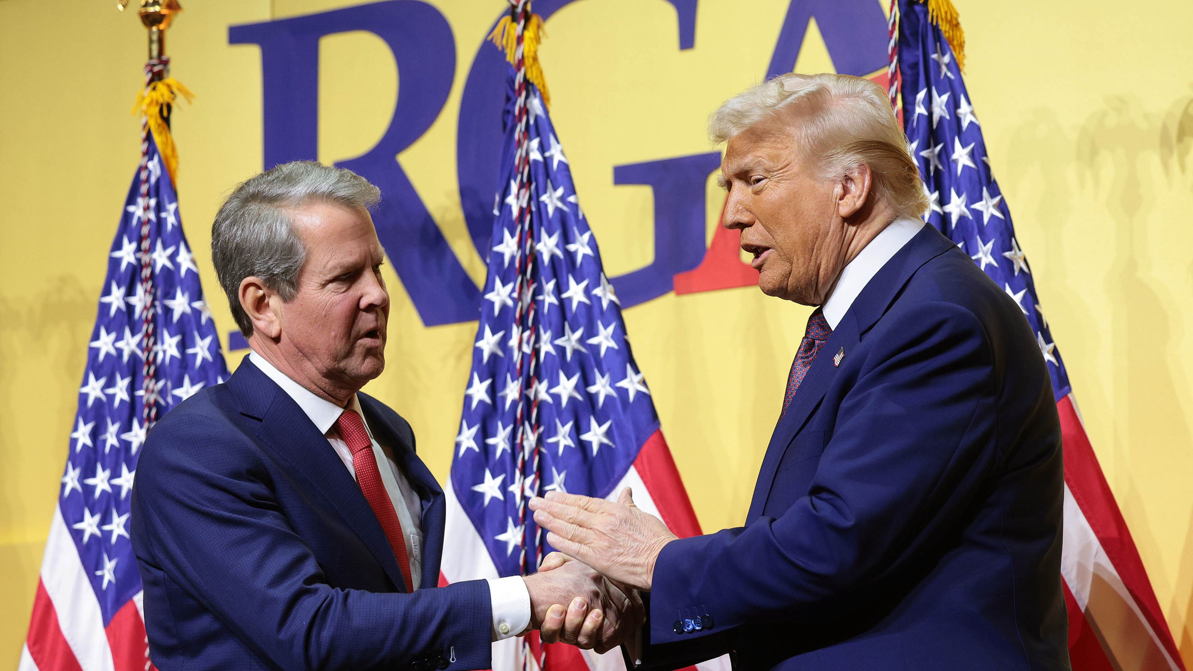 President Donald Trump shakes hands with Gov. Brian Kemp as he delivers remarks at the Republican Governors Association Meeting at The National Building Museum on Feb. 20, 2025, in Washington, D.C. (Win McNamee/Getty Images/TNS)