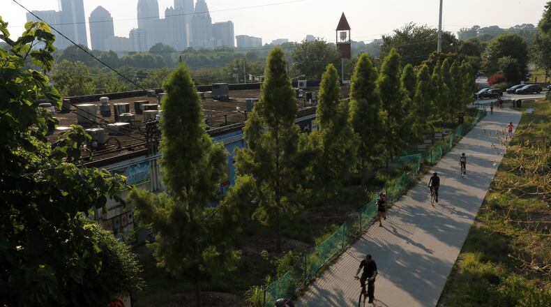Runners, walkers and bikers use the Beltline’s Eastside trail in Atlanta on a Monday evening in July. BEN GRAY / BGRAY@AJC.COM