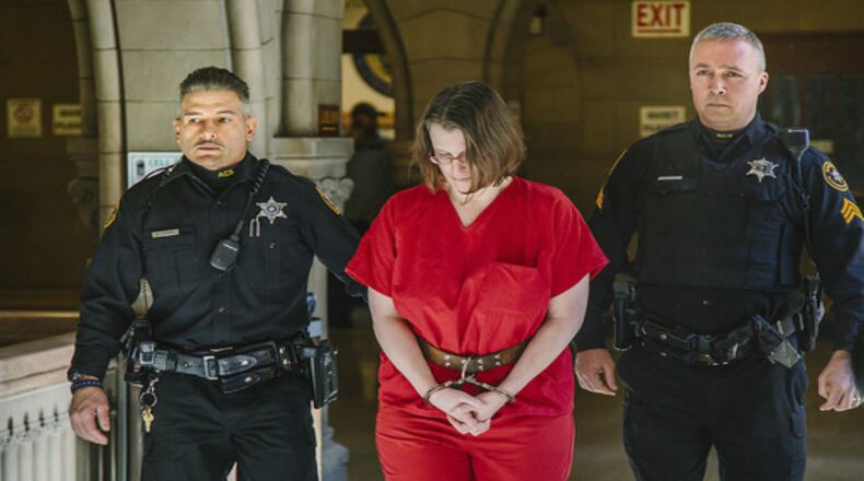 Suspect Laurel Schlemmer, who is accused of drowning two of her sons in a bathtub in 2014, is escorted to the courtroom at the Allegheny County Courthouse for her nonjury trial on Wednesday, March 8.