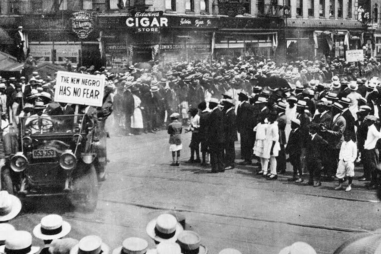A parade by the Universal Negro Improvement Association works its way through Harlem in 1920, and features a slogan about the "New Negro." In the early 20th century, the Harlem Renassaince embraced and promoted a new wave of advocacy, culture and pride, which some called "The New Negro Movement." (NY Public Library Public Colletions)