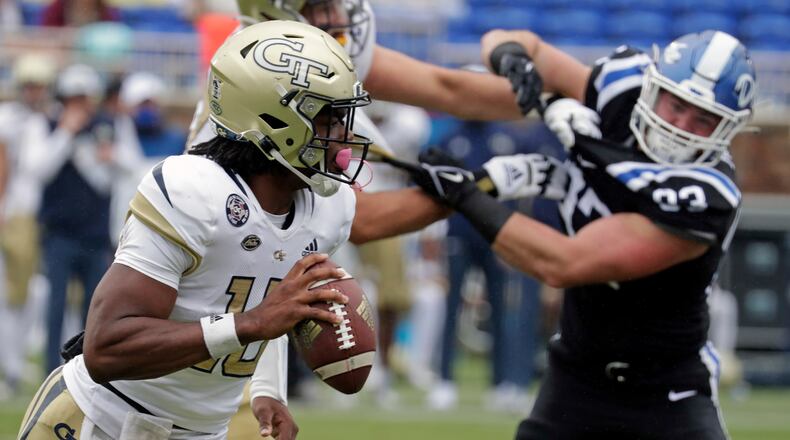 Georgia Tech quarterback Jeff Sims (10) rolls out against Duke defensive end Ben Frye (93) during the first half of an NCAA college football game in Durham, N.C., Saturday, Oct. 9, 2021. (AP Photo/Chris Seward)