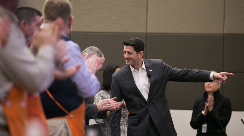 Home Depot employees applaud U.S. House Speaker Paul Ryan during a visit to the Home Depot Store Support Center earlier this month. (Photo by Jessica McGowan/Getty Images)