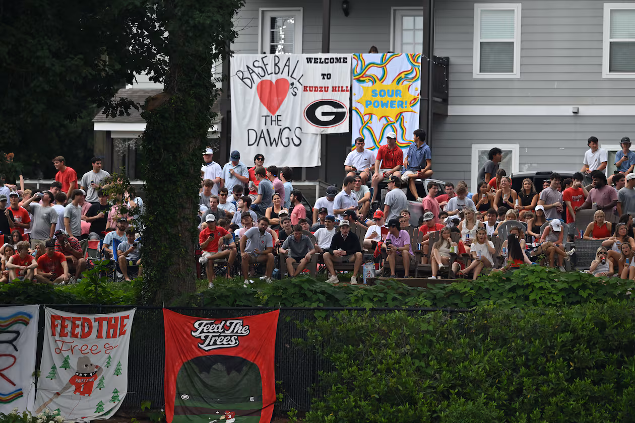 Georgia fans watch from outside the stadium fence during the second inning of their NCAA Regional game at Foley Field, Friday, May 29, 2026, in Athens. (Hyosub Shin/AJC)