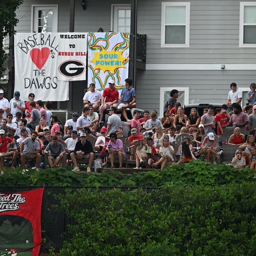 Georgia fans watch from outside the stadium fence during the second inning of their NCAA Regional game at Foley Field, Friday, May 29, 2026, in Athens. (Hyosub Shin/AJC)