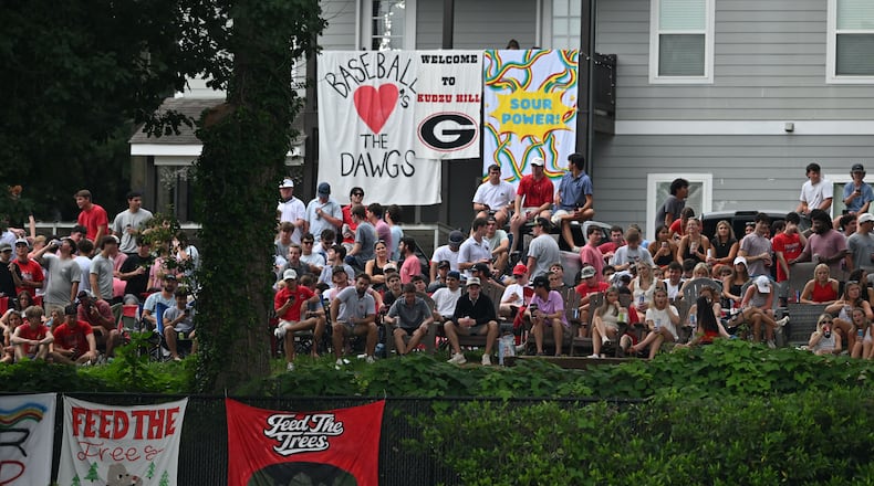 Georgia fans watch from outside the stadium fence during the second inning of their NCAA Regional game at Foley Field, Friday, May 29, 2026, in Athens. (Hyosub Shin/AJC)