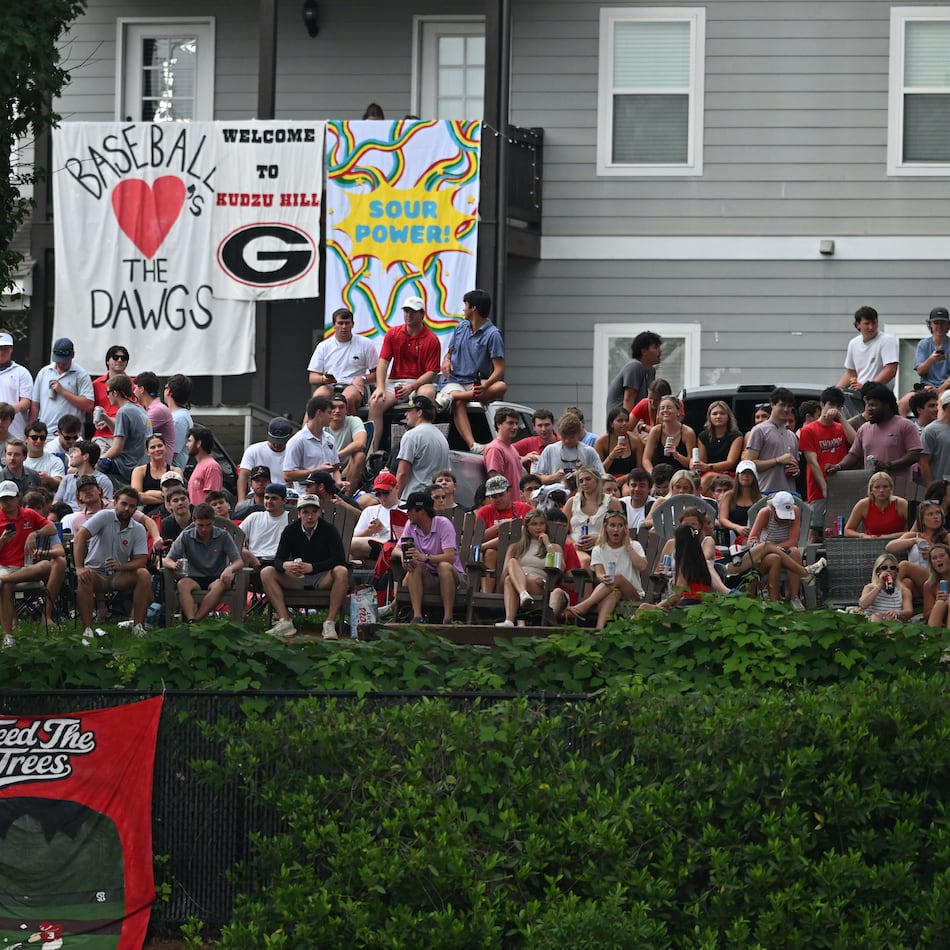 Georgia fans watch from outside the stadium fence during the second inning of their NCAA Regional game at Foley Field, Friday, May 29, 2026, in Athens. (Hyosub Shin/AJC)