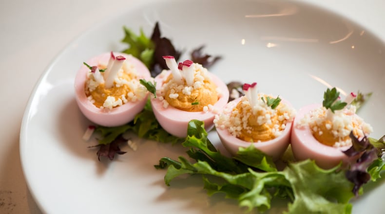 Full Commission Pink Deviled Eggs with beet wash, cotija cheese, and radish. Photo credit- Mia Yakel.