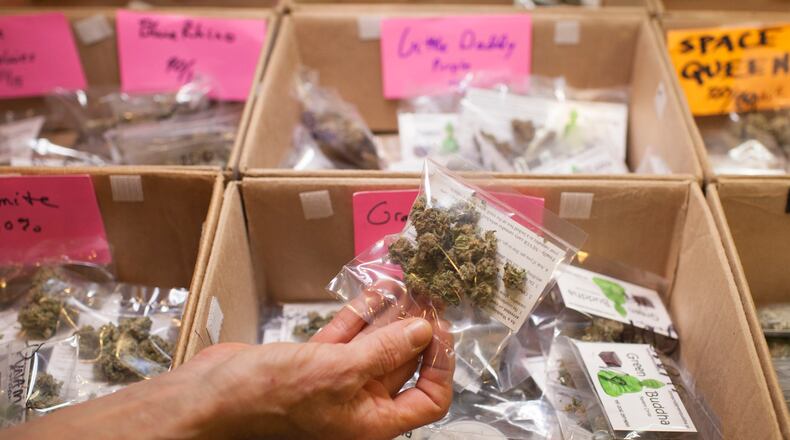 Packages of marijuana for sale at Green Buddha, a patient-based cooperative that dispenses medical marijuana to treat seizures, sleeplessness and other maladies, in Seattle, Feb. 26, 2014. With the advent of recreational marijuana in Washington State, rules for medical providers have changed in ways that could shut down dispensaries. (Matthew Ryan Williams/The New York Times)