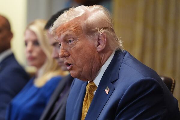President Donald Trump, center, speaking during a cabinet meeting at the White House, Tuesday, July 8, 2025, in Washington. (AP Photo/Evan Vucci)
