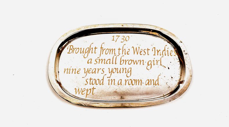 Deborah Dancy's "Small Brown Girl," 2019, embossed text on tray.