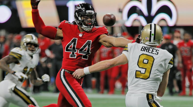 12/7/17 - Atlanta - Atlanta Falcons outside linebacker Vic Beasley (44) pressures New Orleans Saints quarterback Drew Brees (9). Atlanta Falcons play their rival, the New Orleans Saints in an NFL football game at Mercedes-Benz Stadium in Atlanta. BOB ANDRES /BANDRES@AJC.COM