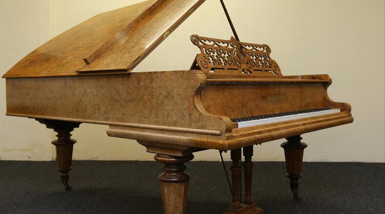 A Bechstein piano used by John Lennon and Paul McCartney, while filming their movie "Help!" in 1965. A MInnesota fourth-grader played Lennon's "Imagine" at a school talent show last week.