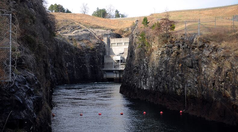 The Chattachoochee River, seen here in 2011, exits the Buford Dam powerhouse in Cumming. Lake Lanier is on the other side. (Bita Honarvar / AJC file)