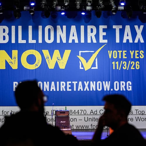 FILE - A large banner is seen at a campaign event for a proposed "billionaires tax" in Los Angeles on Feb. 18, 2026. (AP Photo/Jae C. Hong, File)