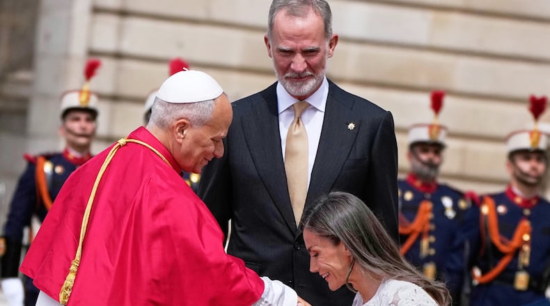 Pope Leo XIV is welcomed by Spain's King Felipe VI and Queen Letizia, as he arrives at the Royal Palace in Madrid, Saturday, June 6, 2026, on the first day of his seven-day apostolic journey to mainland Spain and the Canary Islands. (AP Photo/Alessandra Tarantino)