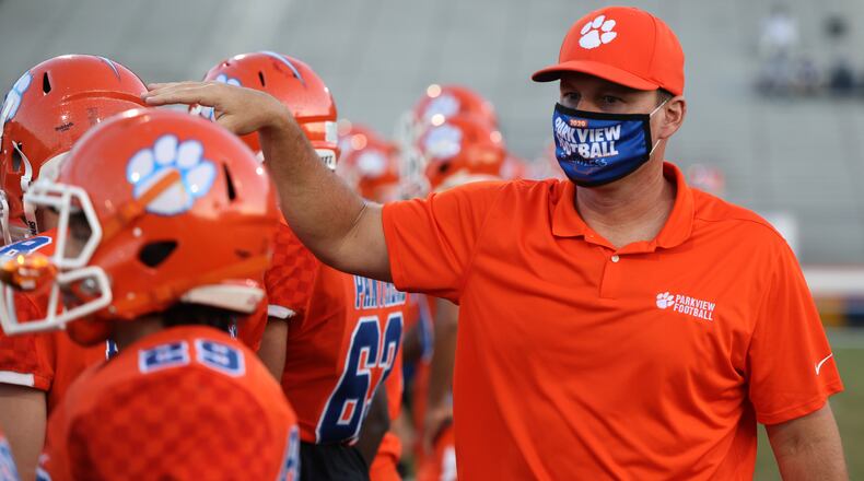 Parkview head coach Eric Godfree greets his players before a regular-season game against Marietta.