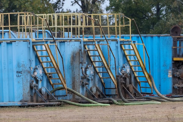 Storage containers for soil amendment are seen on a field near the town of Mitchell on Wednesday, October 12, 2022.   (Arvin Temkar / arvin.temkar@ajc.com)