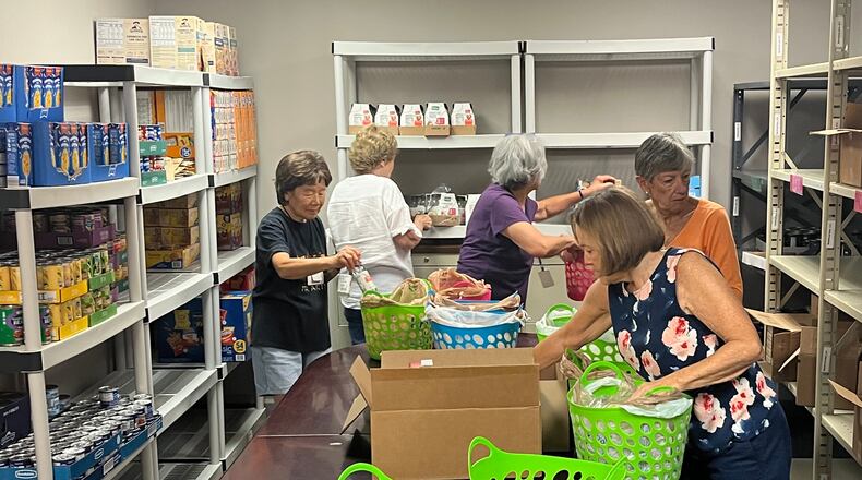 Volunteers from the Assistance League of Atlanta support a variety of causes and needs, including assembling supplies for local elementary schools. Courtesy