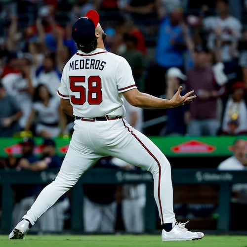 Atlanta Braves pitcher Victor Mederos reacts after defeating the San Diego Padres during the ninth inning of a baseball game, Monday, July 20, 2026, in Atlanta. (AP Photo/Erik S. Lesser)