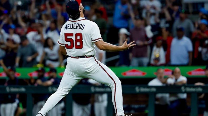 Atlanta Braves pitcher Victor Mederos reacts after defeating the San Diego Padres during the ninth inning of a baseball game, Monday, July 20, 2026, in Atlanta. (AP Photo/Erik S. Lesser)