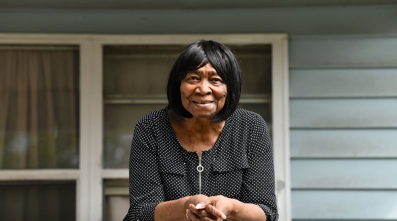 Portrait of Sally Hollis at her Habitat home built by Jimmy and Rosalynn Carter and many volunteers in 1988, on Foote Street, Tuesday, September 12, 2023, in Atlanta. Neighbors in the 20-home cluster in the Edgewood section of Atlanta used to live in run-down apartments and rented homes, and grew weary of raising families where there was so much crime and drugs. (Hyosub Shin / Hyosub.Shin@ajc.com)