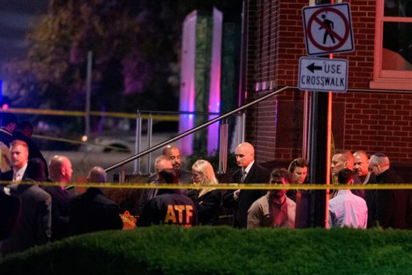 Attorney General Pam Bondi, center, walks to her car as law enforcement work the scene after two staff members of the Israeli Embassy in Washington were shot and killed outside the Capital Jewish Museum, Thursday, May 22, 2025, in Washington. (AP Photo/Rod Lamkey, Jr.)