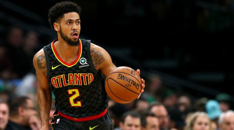 Tyler Dorsey of the Atlanta Hawks dribbles against the Boston Celtics during the first quarter at TD Garden on December 14, 2018 in Boston, Massachusetts. (Photo by Maddie Meyer/Getty Images)