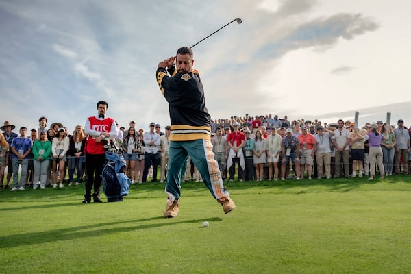 This image released by Netflix shows Adam Sandler in a scene from "Happy Gilmore 2." (Scott Yamano/Netflix via AP)