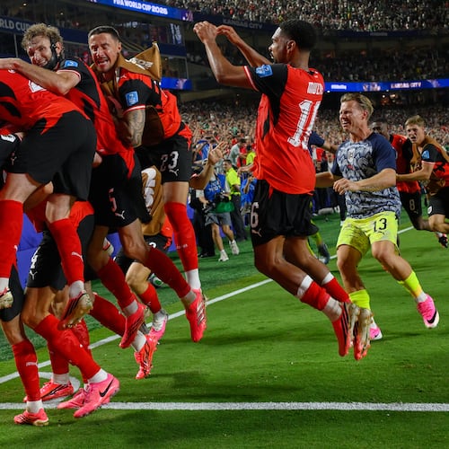 Austria's players celebrates after Austria's Sasa Kalajdzic (14) scored to tie the match during the World Cup Group J soccer match between Algeria and Austria in Kansas City, Mo., Saturday, June 27, 2026. (AP Photo/Reed Hoffmann)