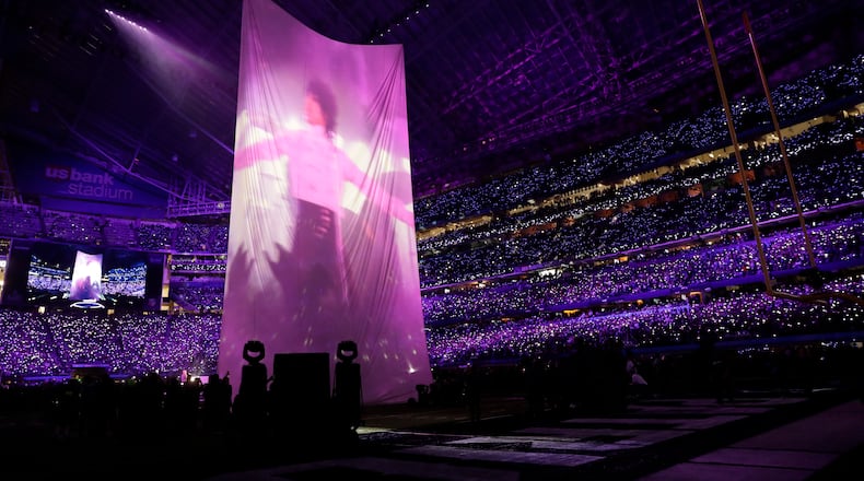 Justin Timberlake performs with an image of Prince during halftime at the NFL Super Bowl 52 football game between the Philadelphia Eagles and the New England Patriots, Sunday, Feb. 4, 2018, in Minneapolis. (AP Photo/Tony Gutierrez)