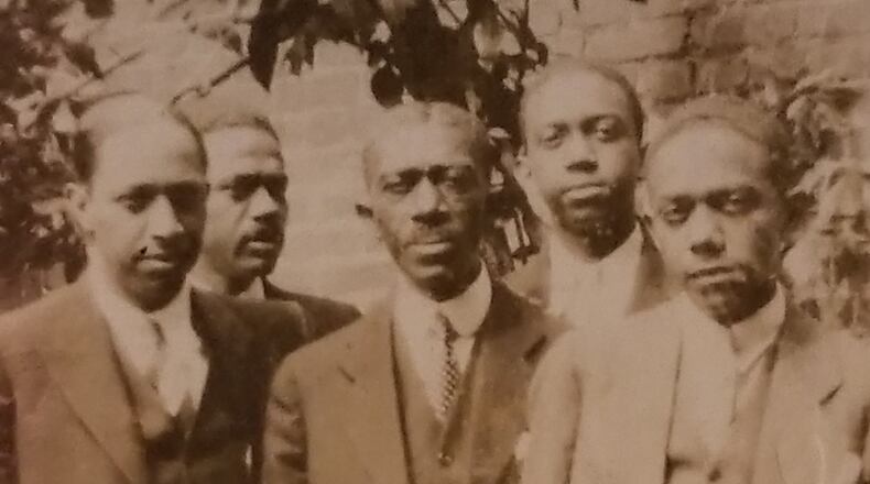 Hogansville, Ga., postmaster Isaiah Lofton (center) and his four sons. The Ku Klux Klan in Hogansville tried to kill Lofton. He later moved to Washington, D.C. CONTRIBUTED