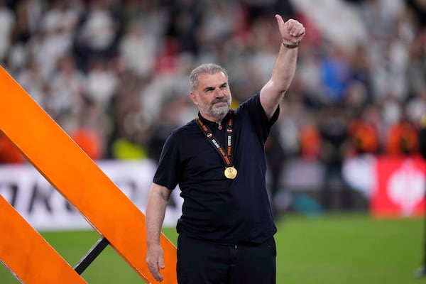 Tottenham's head coach Ange Postecoglou applauds fans at the end of the Europa League final soccer match between Tottenham Hotspur and Manchester United at the San Mames Stadium in Bilbao, Spain, Wednesday, May 21, 2025. (AP Photo/Bernat Armangue)
