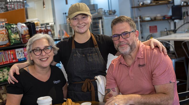 Husband and wife Keith and Nicki Schroeder and their daughter Madison (center) are partners in Schroeder’s Market in Brunswick. (Stephen B. Morton for The Atlanta Journal-Constitution)