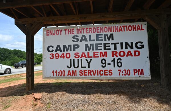 A sign is displayed off Salem Road outside Salem Camp Ground in Covington, site of one of the country's oldest Christian revivals, on Wednesday, July 7, 2021. In 193 years, two years of the Civil War and the COVID-19 pandemic are the only times that the Salem Campmeeting has not been held in person. Last year, the religious revival was held virtually, but this year, the "tents" will be full again. (Hyosub Shin / Hyosub.Shin@ajc.com)