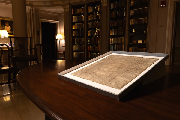 This photo provided by Harvard Law School shows a rare copy of the Magna Carta from 1300 sits in a display case on April 15, 2025, at Harvard Law School in Cambridge, Mass. (Lorin Granger/Harvard Law School via AP)