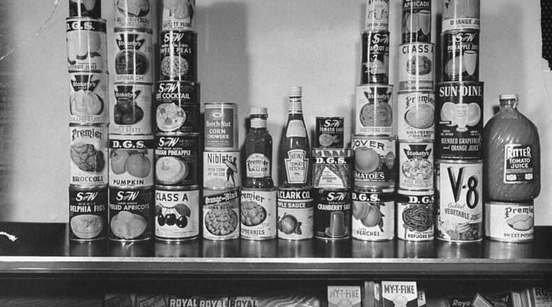 Canned goods sitting on shelf waiting to be purchased with ration stamps. (Photo by Myron Davis/The LIFE Picture Collection/Getty Images)
