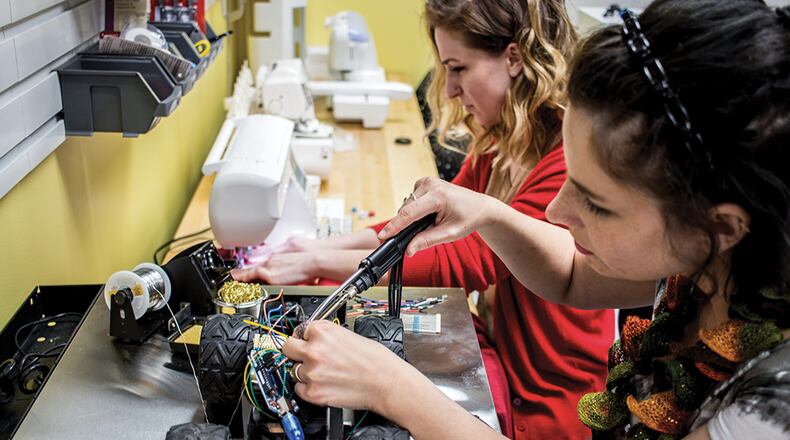 Two women work at a makerspace in Dayton, Ohio. Roswell hopes to open its makerspace within two months.