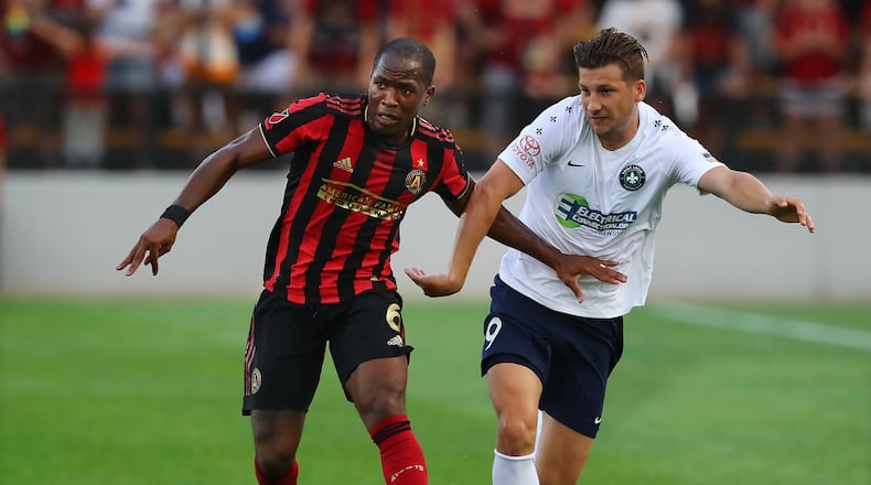 Atlanta United midfielder Darlington Nagbe works against St. Louis forward Russell Cicerone in a U.S. Open Cup quarterfinals soccer match on Wednesday, July 10, 2019, in Kennesaw. Curtis Compton/ccompton@ajc.com