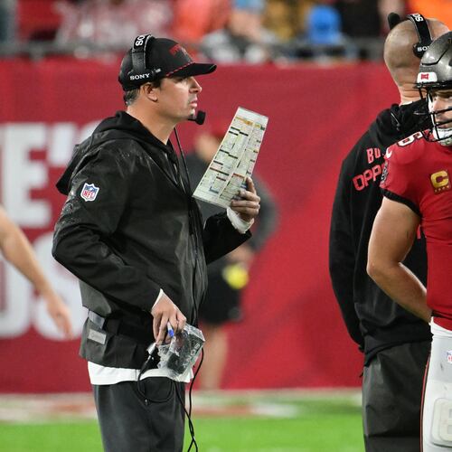 Tampa Bay Buccaneers quarterback Baker Mayfield (6) talks to offensive coordinator Josh Grizzard during the second half of an NFL football game Saturday, Jan. 3, 2026, in Tampa, Fla. (AP Photo/Jason Behnken)