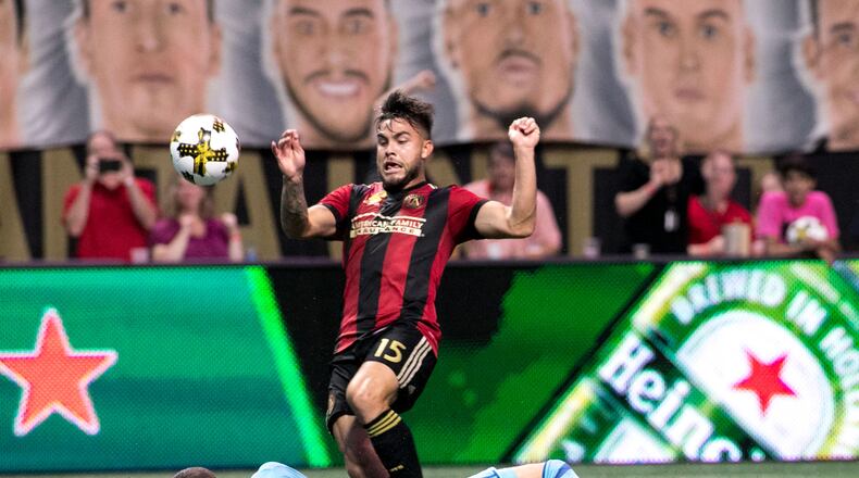 Atlanta United forward Hector Villalba (15) kicks the ball over Montreal Impact goalkeeper Evan Bush (1) during the second half of a MLS soccer game at Mercedes-Benz Stadium, Sunday, Sept. 24, 2017, in Atlanta. BRANDEN CAMP/SPECIAL