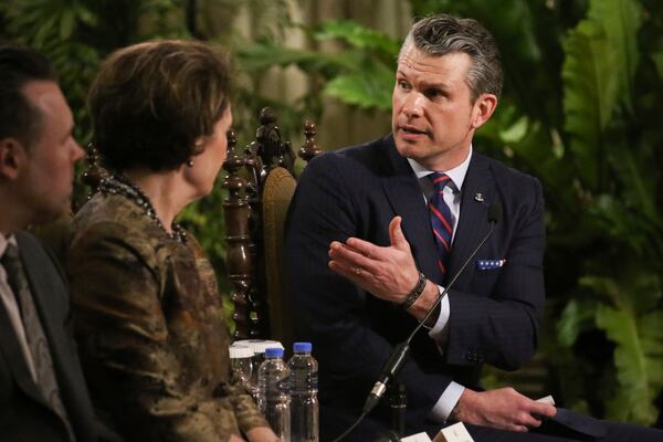 U.S. Defense Secretary Pete Hegseth, right, gestures as he speaks during a meeting at the Malacanang presidential palace in Manila, Philippines, Friday, March 28, 2025. (AP Photo/Basilio Sepe, Pool)