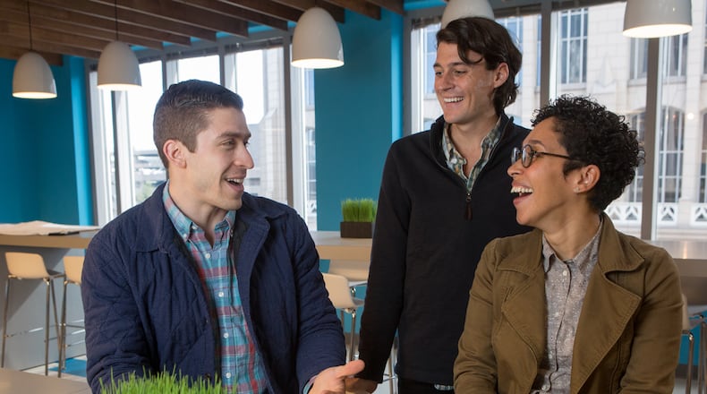 (l-r)Greg Klingshirn, Peter Haas,  & Mnica Cottrell chat at the SalesLoft offices in Atlanta on February 2nd, 2018. For story in the AJC Top Workplaces section.  (Photo by Phil Skinner)